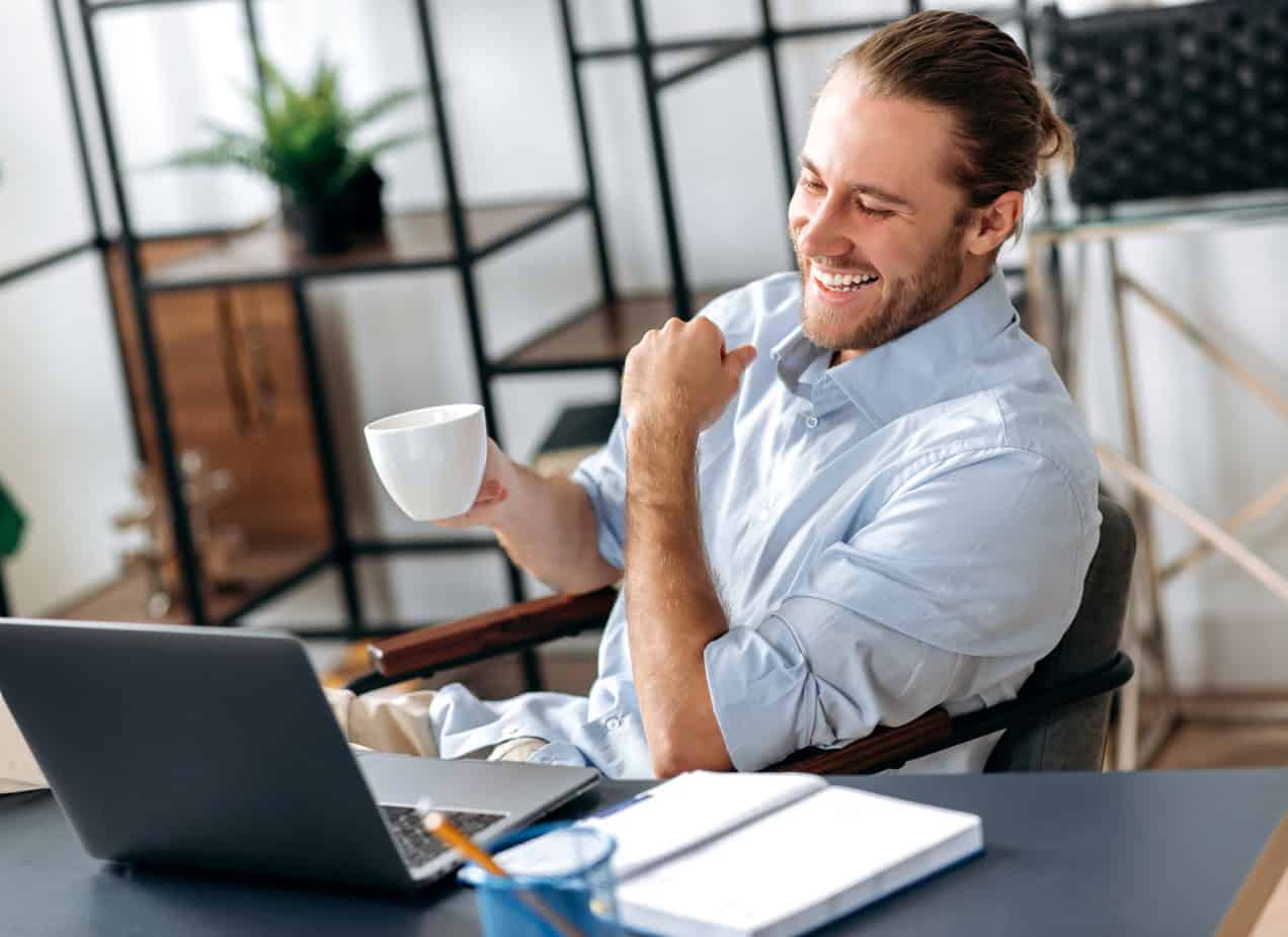 Man smiling at desk